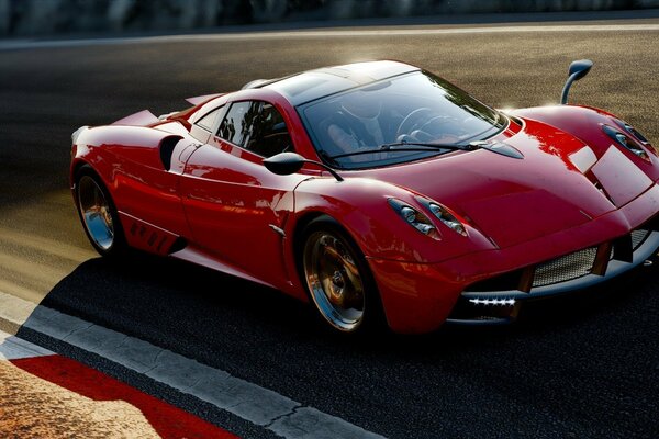 The red supercar is standing in the sun