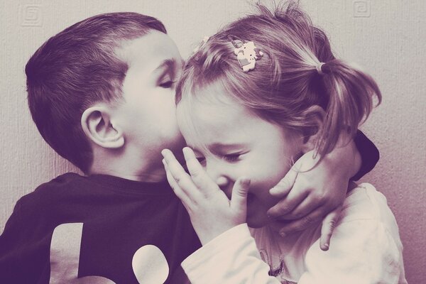 Cute kids kiss on an old photo