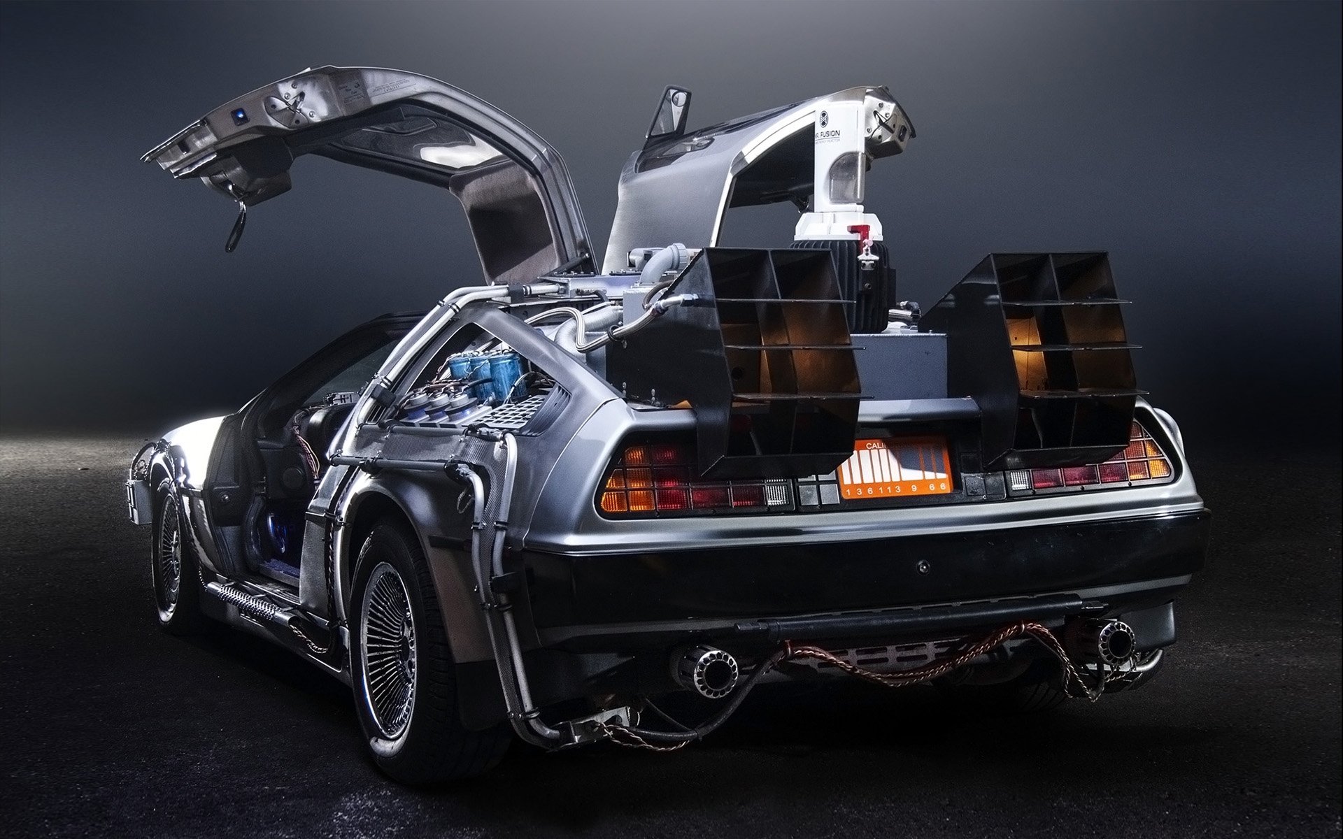 delorean dmc-12 back to the future time machine delorean rear view exhaust doors background