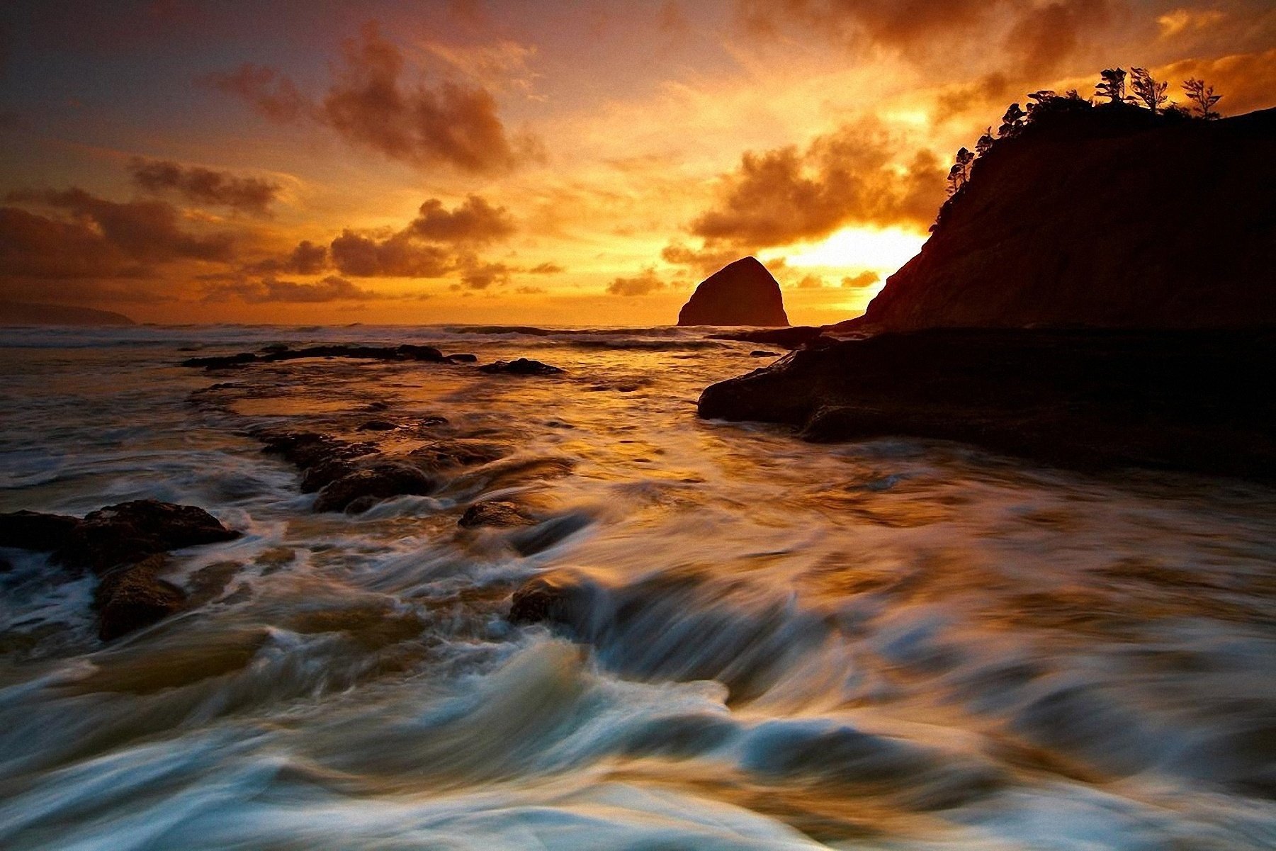 unset sea rocks coast the sky