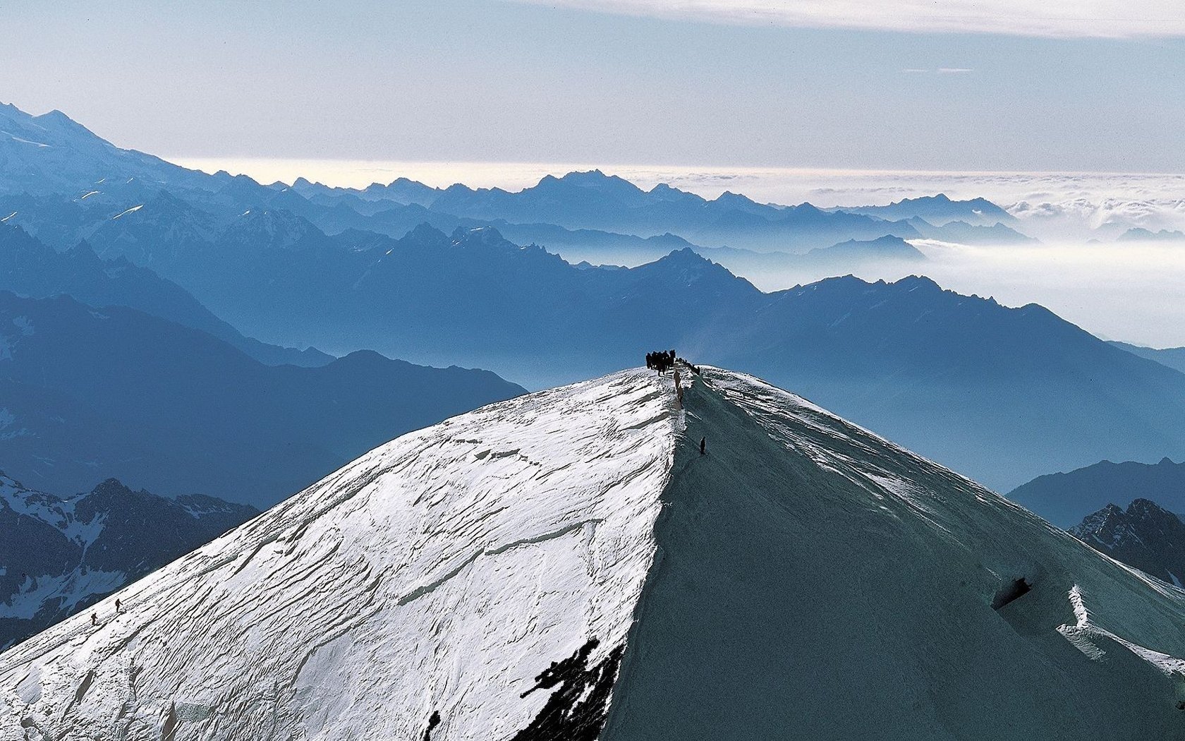 mountains fog snow the sky people