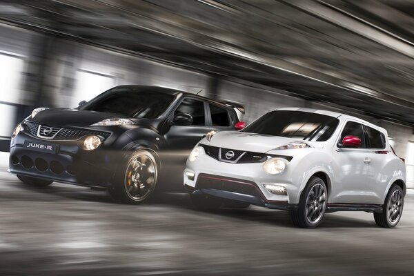 White and black car compete in speed