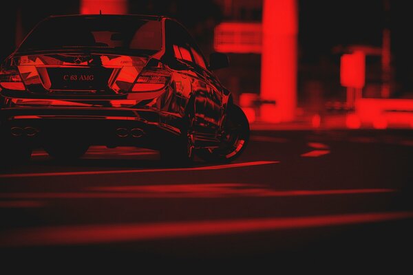Mercedes Benz, participating in a race around the city, is depicted in red and black