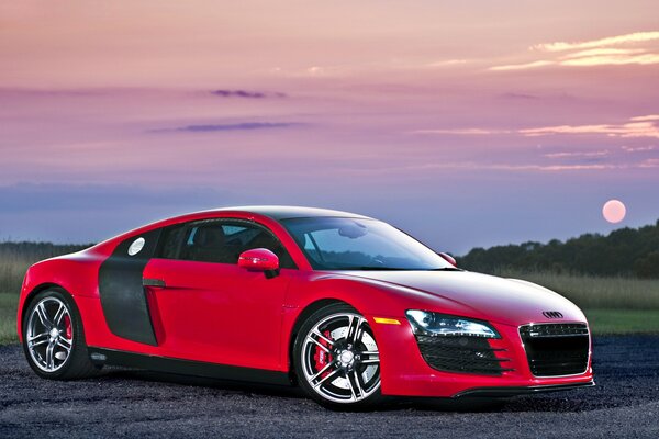 Beautiful car on the background of a bright sunset