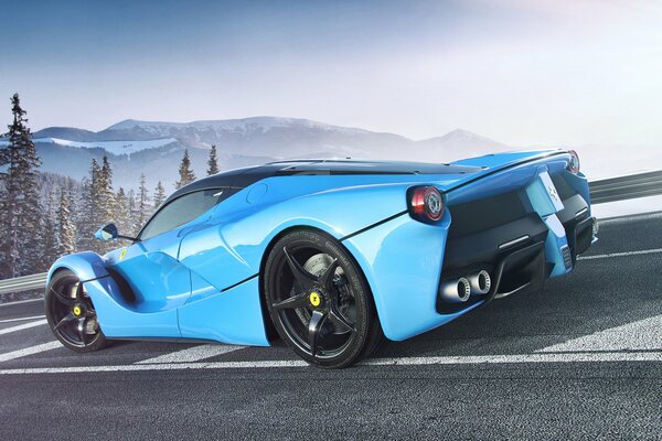 Blue Ferrari on the background of snow-capped mountains