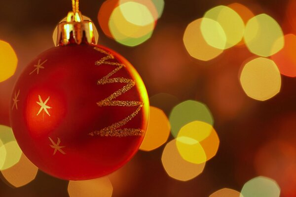 Christmas ball on a festive background