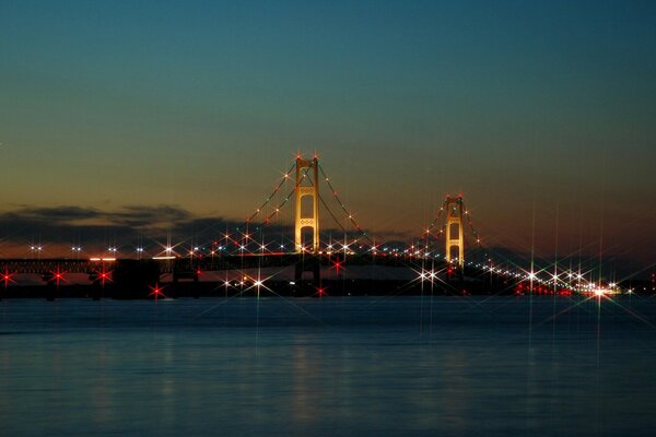 A city with a bridge at sunset p