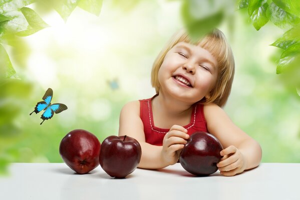 Happy girl with apples