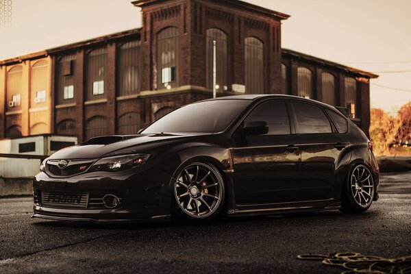 Subaru impreza black at sunset looks very nice