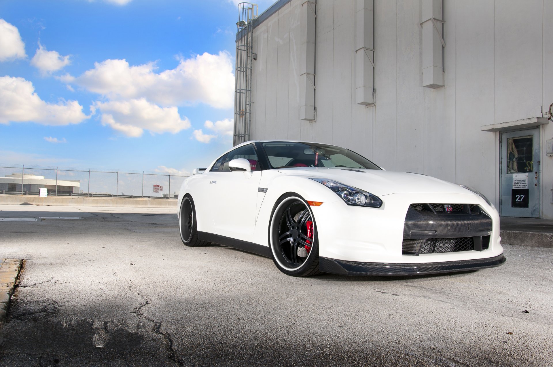 nissan gtr r35 white nissan gtr building door staircase sky clouds fence