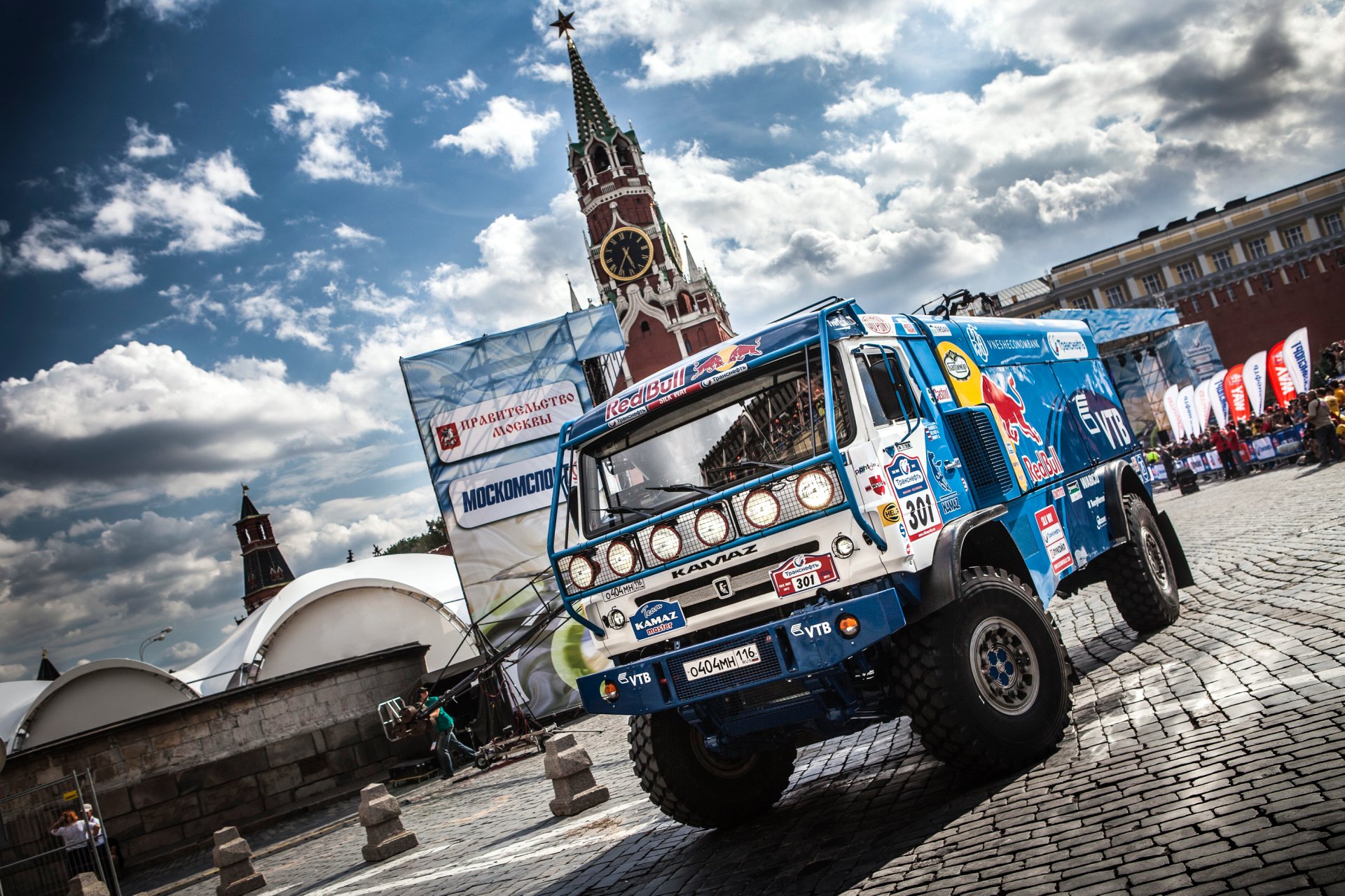 kamaz truck dakar blue red bull auto car sport day rally front city moscow paving stones sky cloud