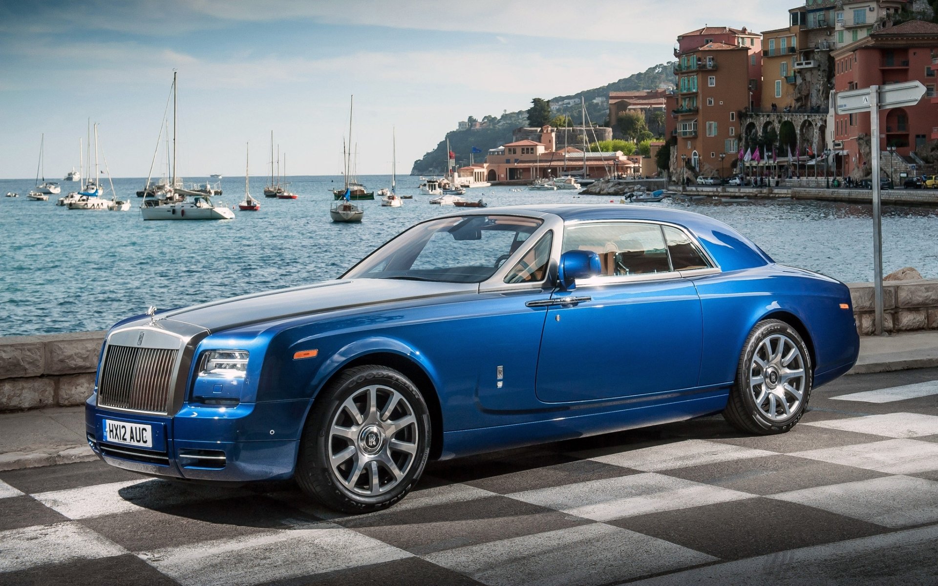 rolls-royce phantom coupe rolls-royce phantom blue front luxury car embankment water yachts sky background