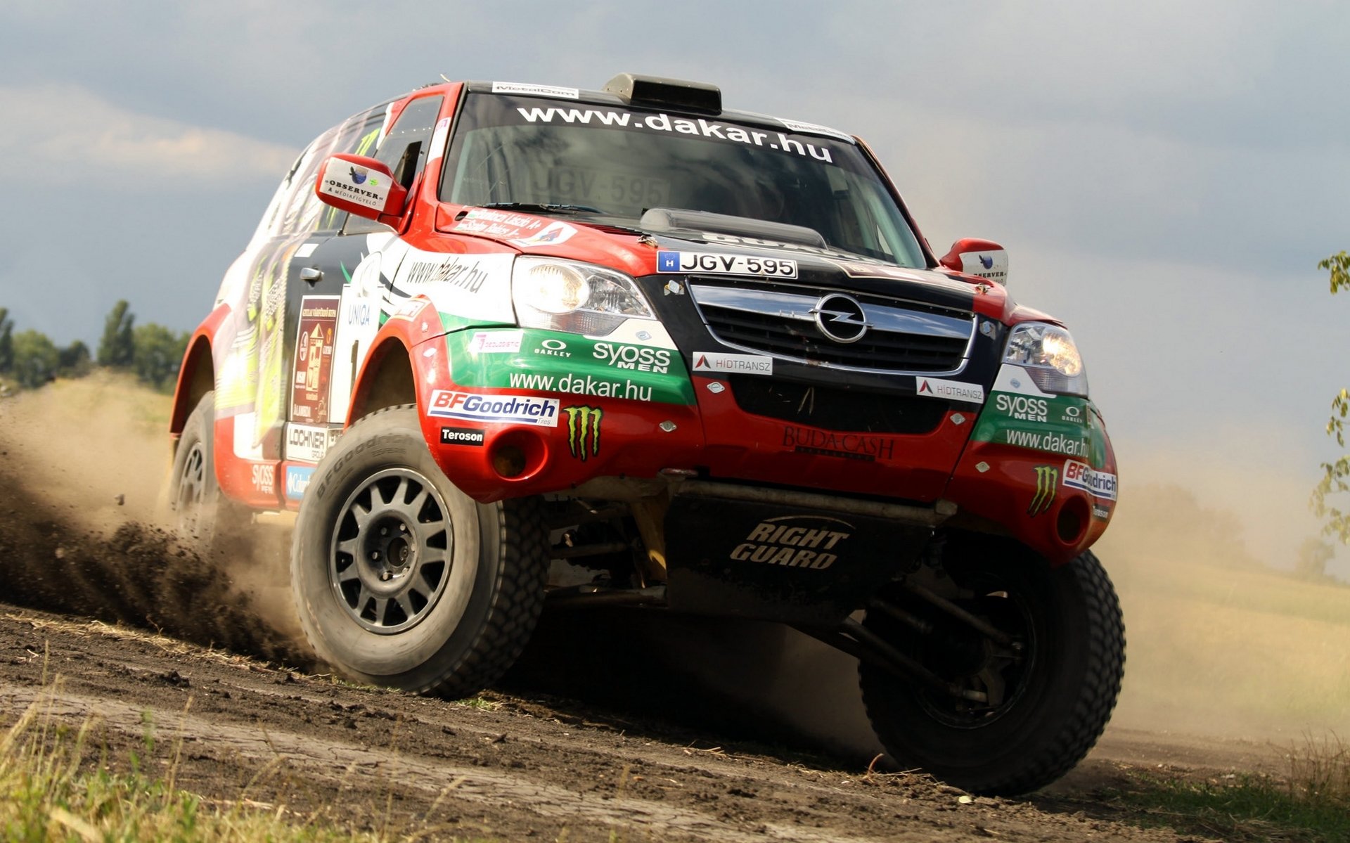 opel dakar rajd auto suv przód logo sport samochód reflektory skid turn day rally koła w ruchu jeep