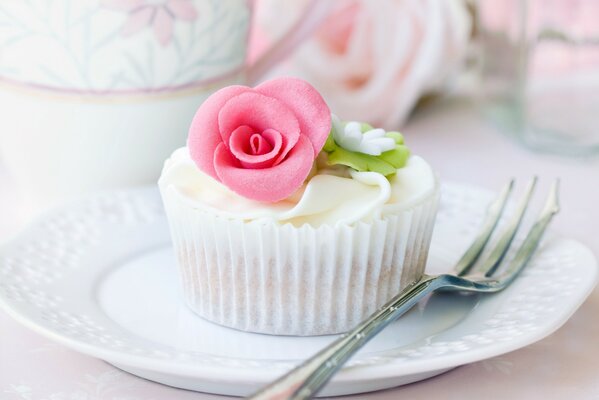 A delicate dessert with a rose. Beautiful dishes