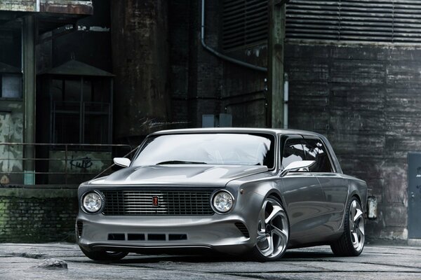 Silver Lada with tuning on the background of an old building