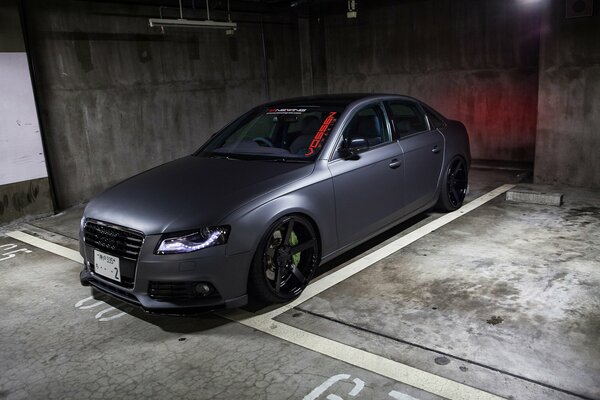 Grey tuned Audi RS4 in the parking lot