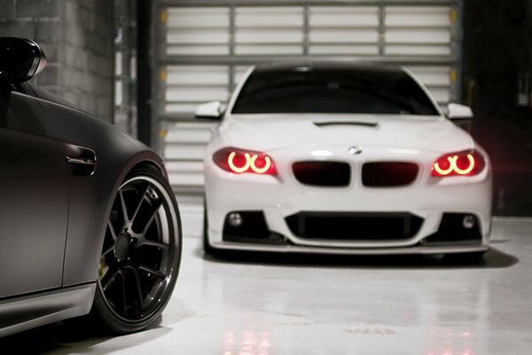 White bmw m3 car in the garage