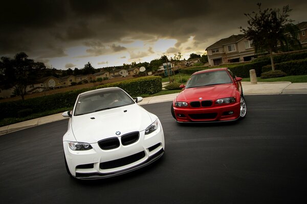 Two cars in white and red