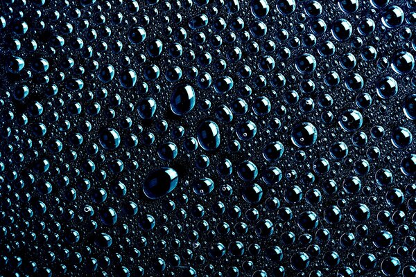 Texture of large drops on a dark background