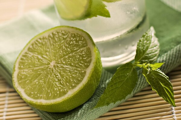 Sliced lime with a sprig of mint