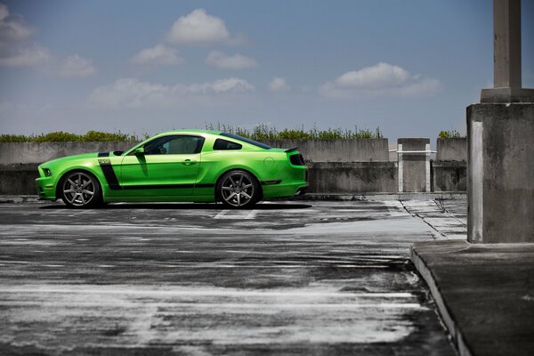 A green car with three doors