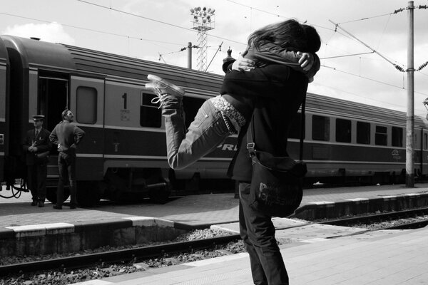 Joyful meeting of people at the train station