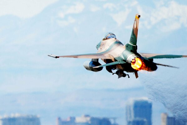 F-16 fighter in the sky rear view