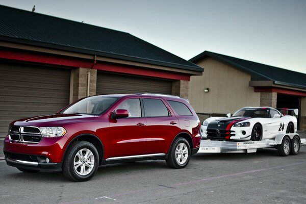 Dodge Durango and supercar page 10 on the background of houses