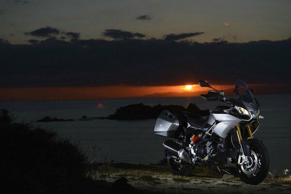 Motorcycle, aprilia caponord 1200 on sunset background