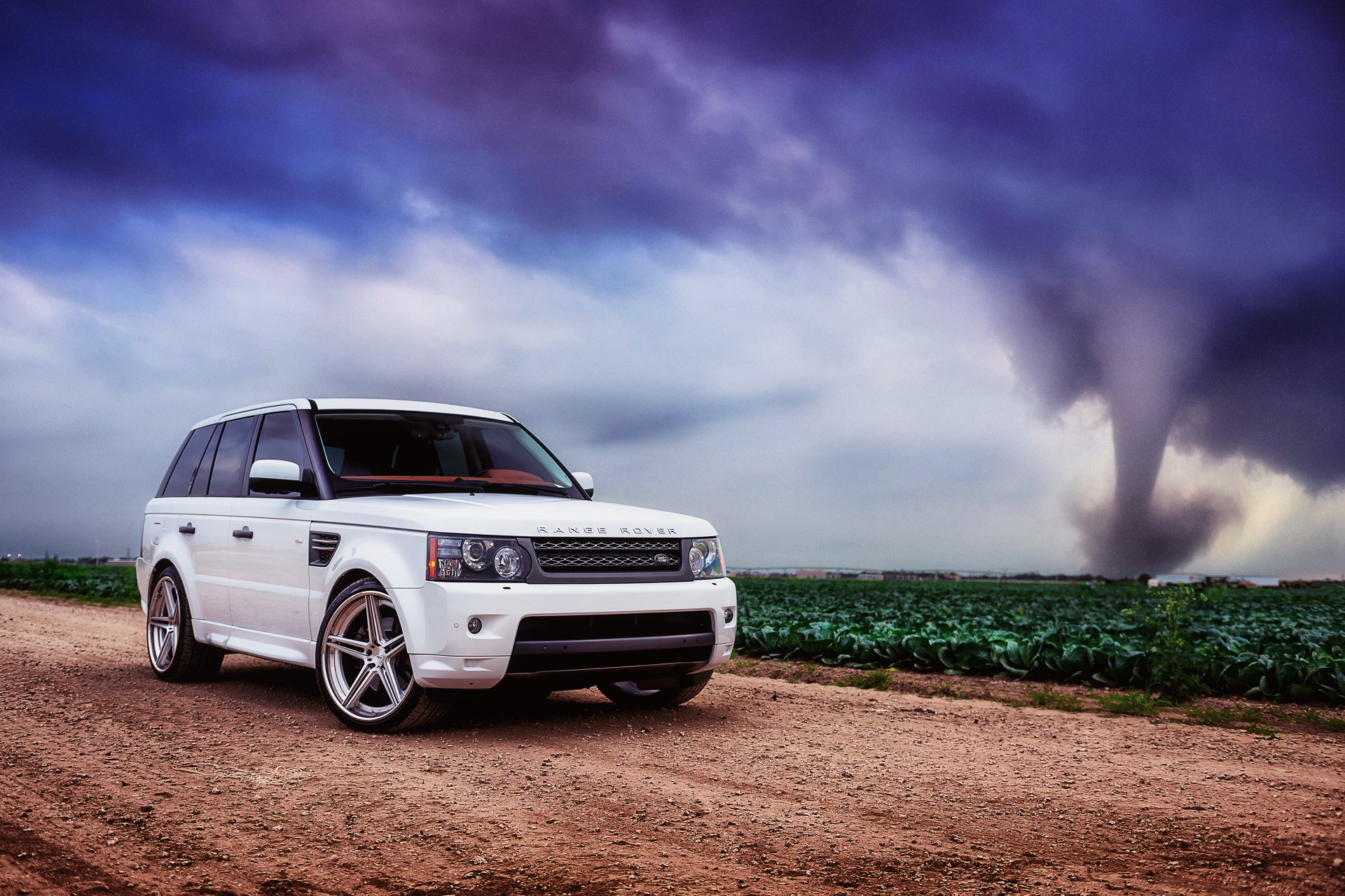 land rover range rover sport white land rover range rover road field cabbage sky clouds hurricane tornado