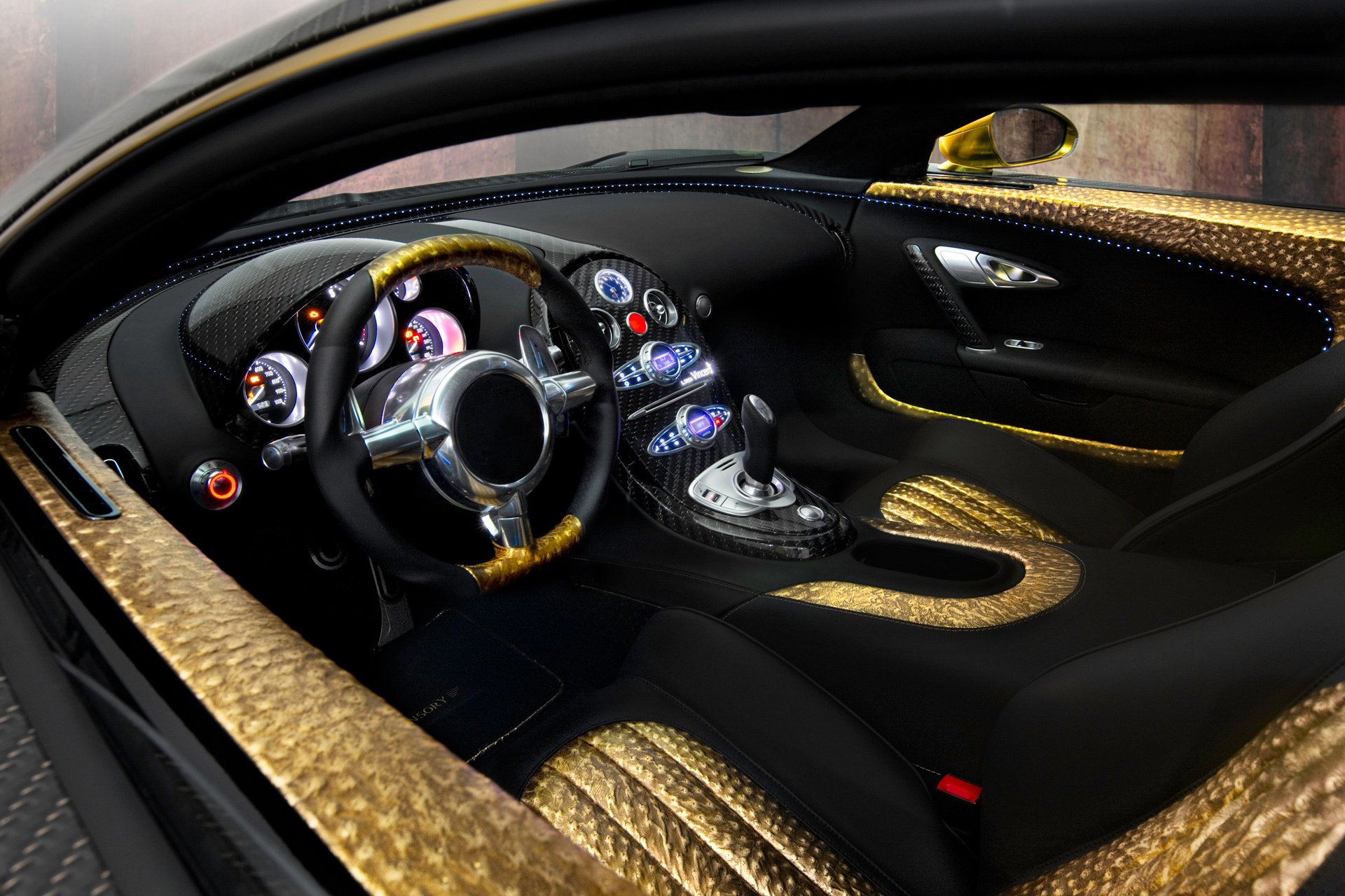 bugatti veyron 16.4 linea vincero d oro mansory auto bugatti veyron samochód sportowy wnętrze kierownica panel instrumenty skóra złoto