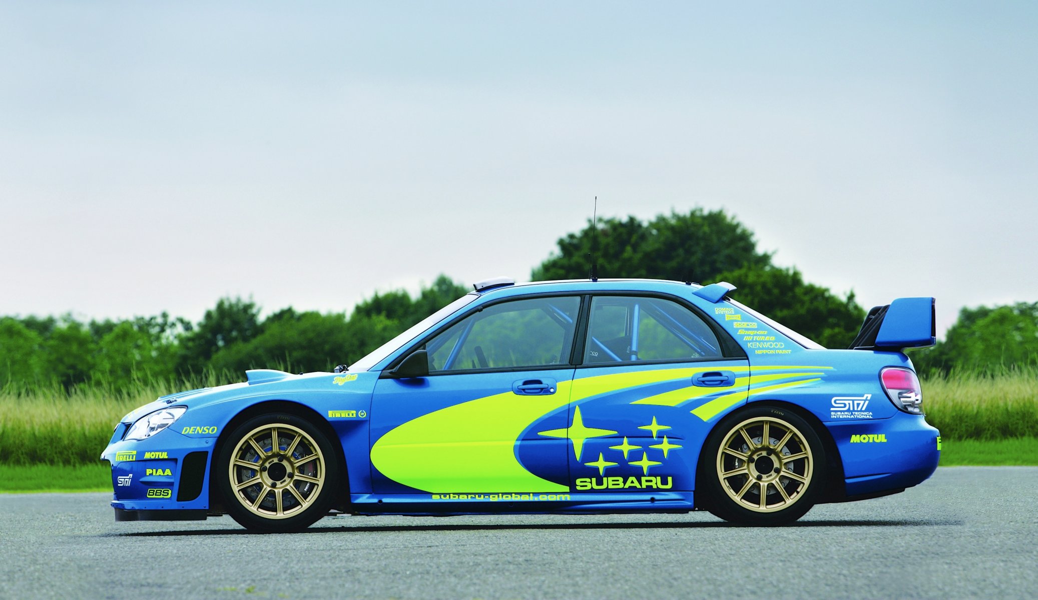 ubaru impreza wrx car wrc rally a side view blue original wheel machine