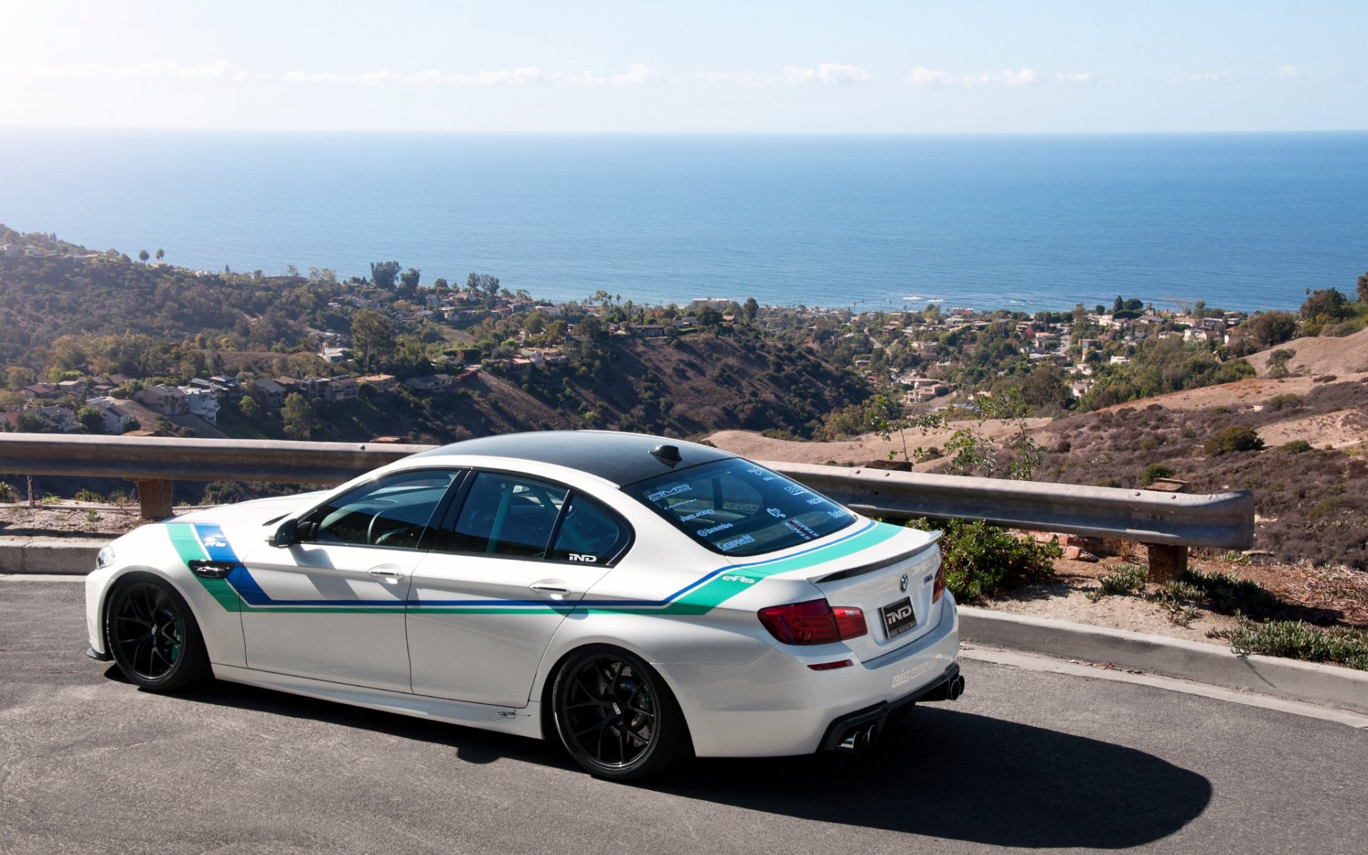 bmw m5 f10 white bmw rear view road bump valley sea