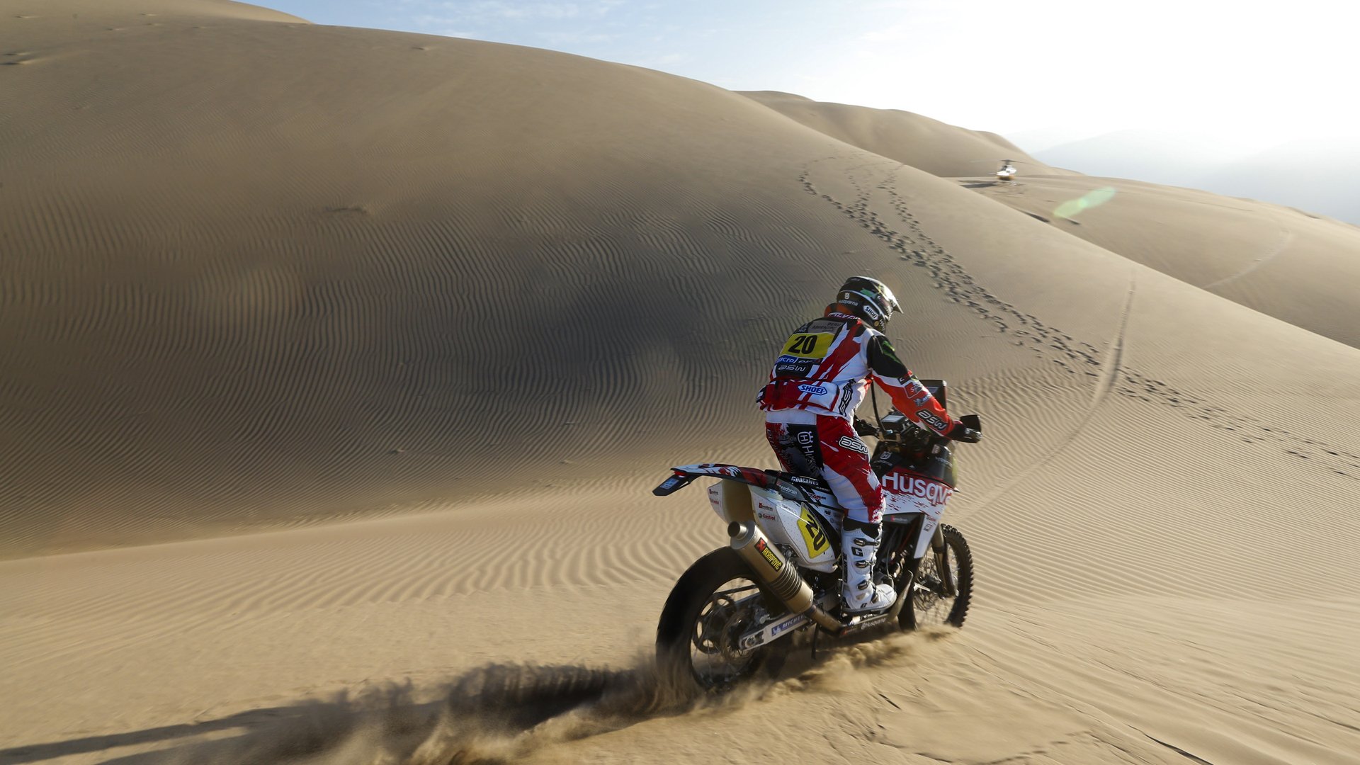 motorcycle racer dakar sand dunes sun rally