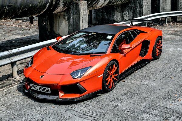 Beautiful red-haired lamborghini with red wheels