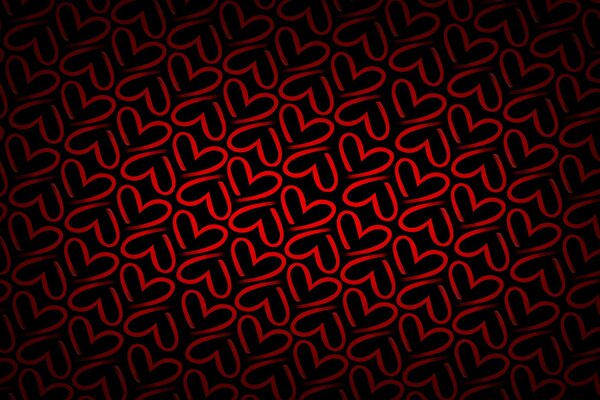 Textura con corazones rojos sobre fondo oscuro