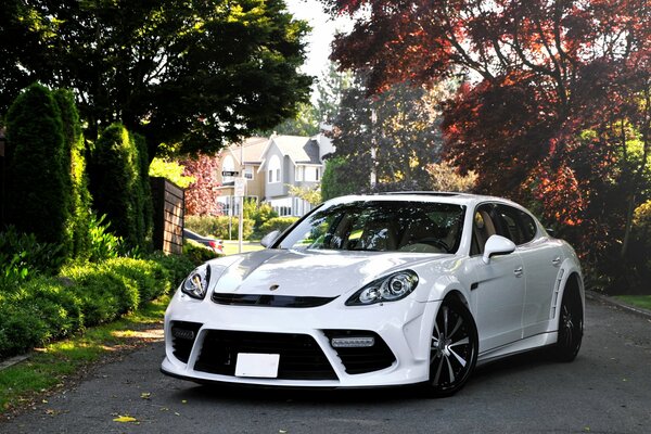 White Porsche panamera on the street