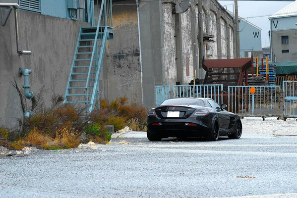 Mercedes benz slr mclaren black rear view at the blue iron gate