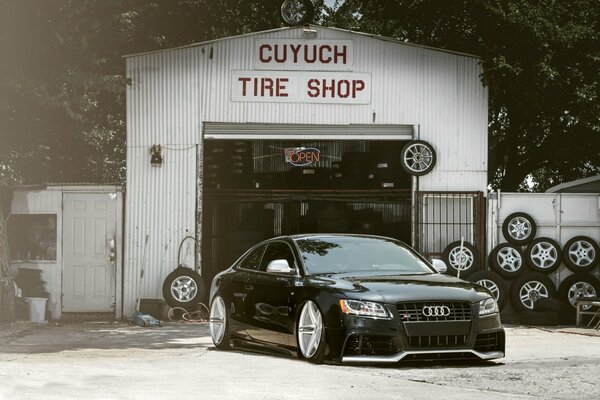 Auto repair car tuning, tires at the fence