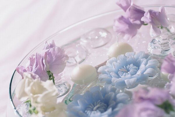 Flower arrangement with candles and water