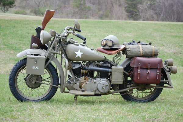 An American motorcycle from the Second World War on the background of a meadow