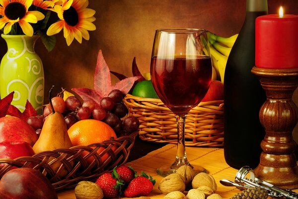 Autumn composition with a glass of red wine