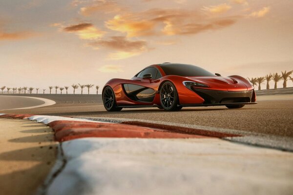 Beautiful McLaren on the track against the background of palm trees