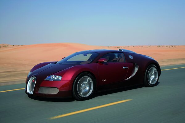 Auto sportiva rossa nel mezzo del deserto