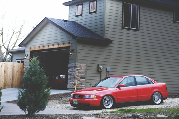 Red Audi on the background of private property