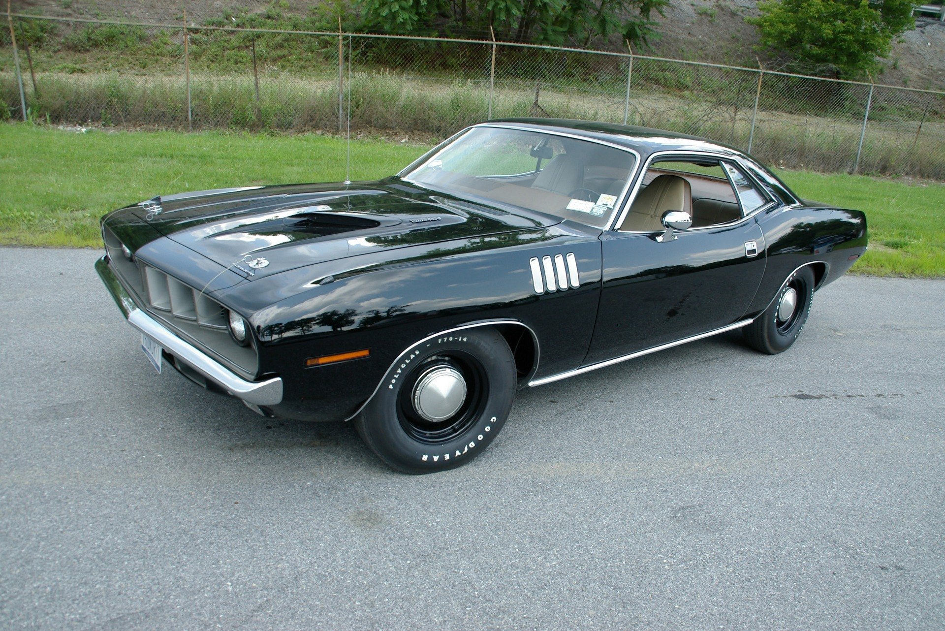 plymouth cuda 1971 black where a side view turf fencing