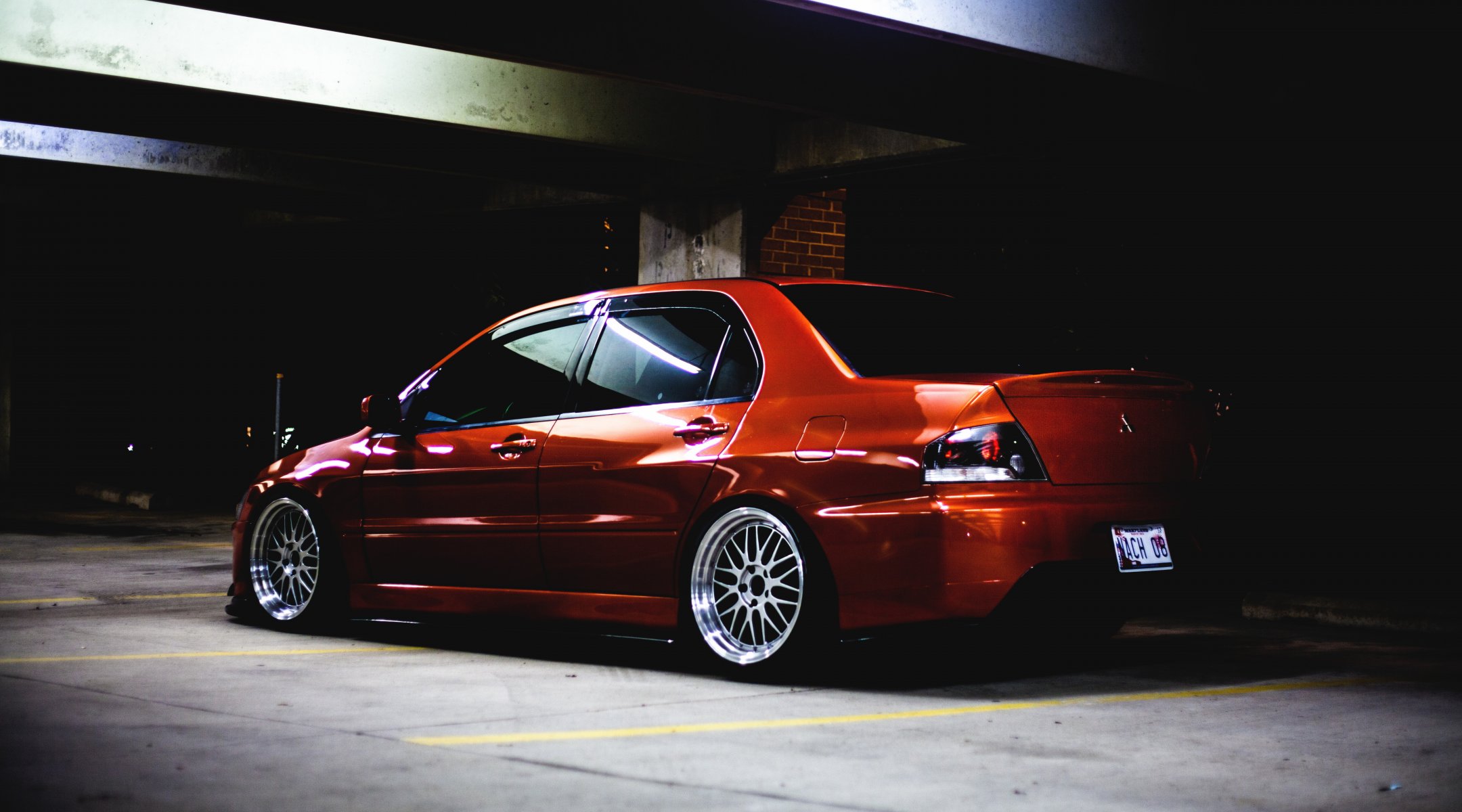 mitshubishi lancer evolution ix evo low orange tuning back of