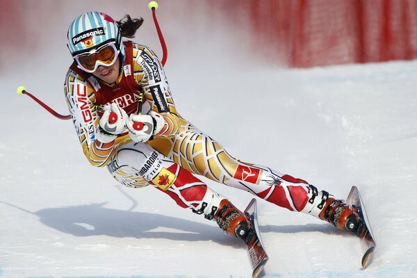 Beautiful skier on the background of snow