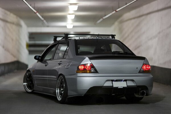 Silver car on a gray background