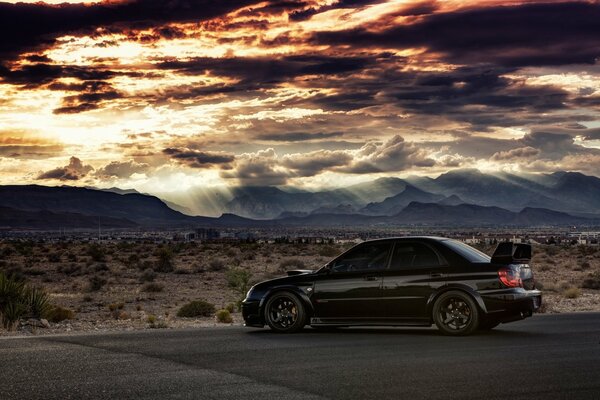 Subaru on the background of the evening sky